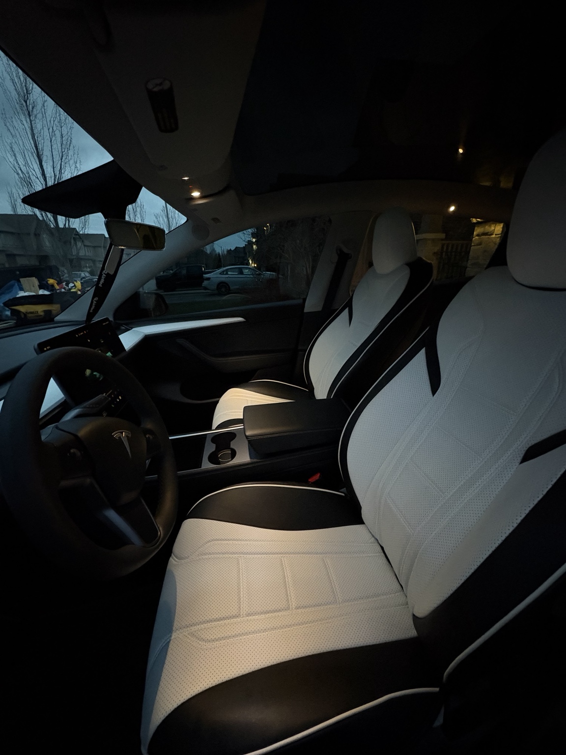Detailed Tesla Model 3 interior with white and black seats